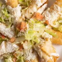 Flautas · Served On A Bed Of Lettuce, Cheese, Sour Cream And Pico de Gallo On Top