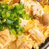 Oyako Don · Chicken and sliced onion cooked with egg in special japanese sauce. Topped with scallion and...