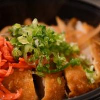 Pork Katsu Don · Pork cutlet cooked with egg and sliced onion in special japanese sauce. Topped with scallion...