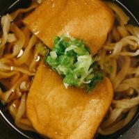 Kitsune Udon · Japanese style udon noodle soup with deep fried bean curd and topped with scallion.