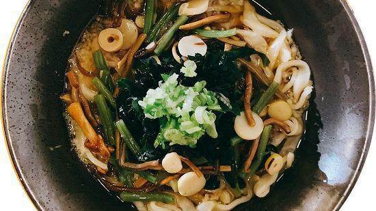 Sansai Udon · Japanese style udon noodle soup topped with japanese wild vegetables, seaweed, and scallion.