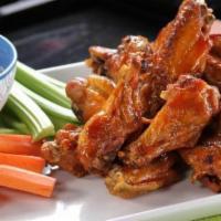 Buffalo Wings (5) · Spicy. Breaded spicy wing, bleu cheese, carrot, celery.