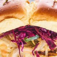 Kansas Pulled Pork Sandwich · Braised pulled pork, pickled cabbage, caramelized onion, bell pepper, swiss cheese, house BB...