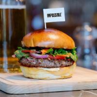 Impossible Burger · PLANT-BASED MEAT TASTE JUST LIKE BEEF, CHEESE, LETTUCE, TOMATO, 
CARAMELIZED ONION, SAUTEED ...