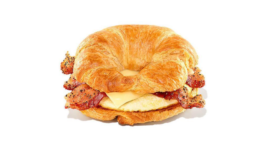 Sweet Black Pepper Bacon Sandwich · Extra bacon caramelized with sweet black pepper seasoning with egg and white cheddar cheese on a buttery croissant. Max 6 per order.
