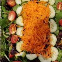 House Salad · A sumptuous blend of lettuce with sweet shredded carrots, cucumbers, and plum tomatoes.