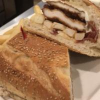 The Luigi Sandwich · Breaded chicken cutlet with bacon, fries, melted mozzarella, and brown gravy on garlic bread.