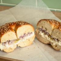 Whitefish · Whitefish salad, pickled tomato and red onions on a bagel.