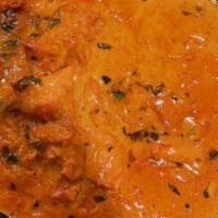 Butter Chicken · Chicken pieces drowned in a gravy of creamy and buttery gravy consisted of exotic spices.