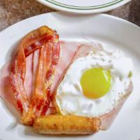 Victor’S Waffles Deluxe · Served with Ham, Bacon, Sausage and one Egg