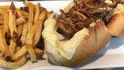 French Dip · sliced rib eye, swiss, provolone, crispy onions, and served with onion au jus