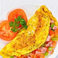 Spanish Omelet  · 3 eggs, ham or turkey, onions, green peppers, tomato.