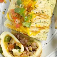 Western Omelet  · 3 eggs, ham or turkey, onions, green peppers.