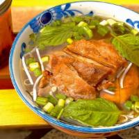 Pho Grilled Pork · Grilled pork loin with rice noodle in beef broth ,onion , jalapeno ,bean sprout and cilantro.