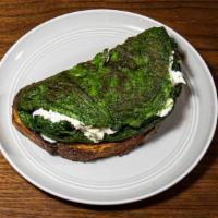 Green Eggs & Damn! · Spinach & basil omelet, Meredith's goat & sheep feta served on sourdough.