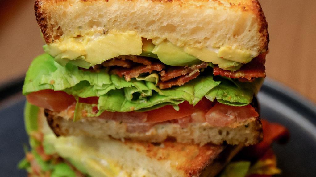 L.A.T. · crispy bacon, Bibb lettuce, avocado, tomato, with a herb mayo served on sourdough.