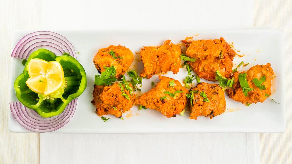 19 Chicken Tikka · Tandoor cooked skewered chicken masala with Indian spices.