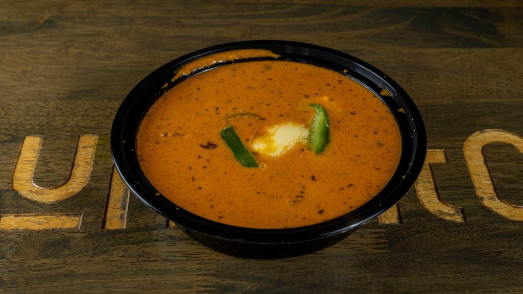 59 Chicken Curry
 · Chicken cooked in traditional Indian gravy & whole spices