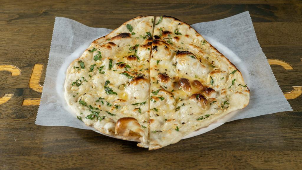 Garlic Naan · Soft Flour bread topped with garlic