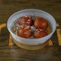 98 Gulab Jamun · A light pastry made from milk and honey