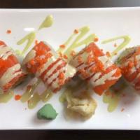 Happy Roll · Spicy. Spicy crunchy snow crab, avocado, topped with fresh salmon, honey Wasabi and tobiko.
