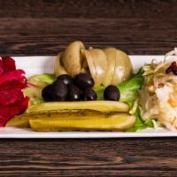 Pickled Veggies · Ensemble of homemade pickled coleslaw, red cabbage, pickles, green tomatoes and olives.