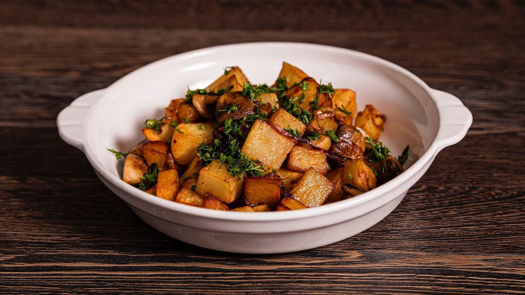 Potato Loves Mushroom · Top menu item. Cubes of potatoes pan-fried and topped with sautéed mushrooms and onions.