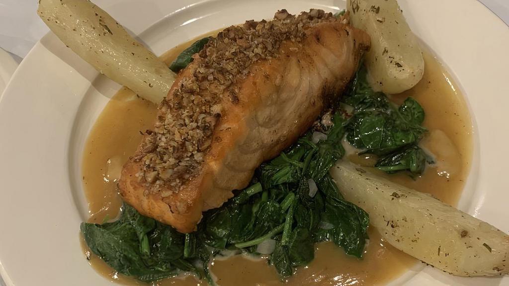 Walnut Crusted Salmon · (8oz) salmon filets pan seared and served over spinach.