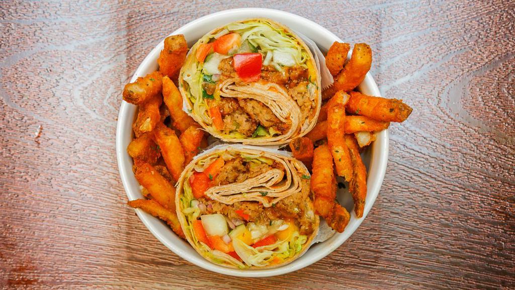 Veggie Wrap · Juicy veggie patty wrapped with lettuce, tomatoes, red onions, peppers, cucumber, mangos, avocado and shredded cheese.