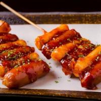 Sausage & Rice Cake Skewer 소떡소떡 (2 Pieces) · Spicy sweet sauce.