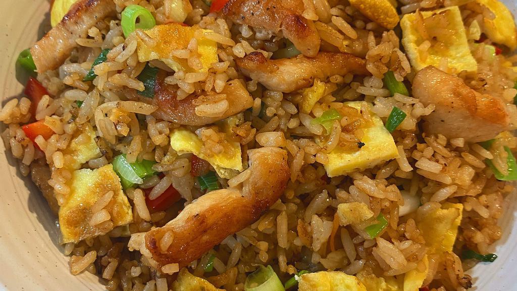 Chaufas · Fried rice, soy sauce, scrambled eggs, red peppers.