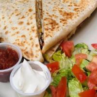Chicken Quesadilla · Ten inch flour tortilla, stuffed with diced grilled chicken, shredded mixed cheese and tomat...