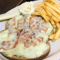 Tuna Melt · Tuna fish salad on grilled rye with melted Swiss served with French fries.