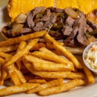 Cheesesteak Sandwich · Tender sliced steak, peppers onions and American cheese on Italian bread, served with French...
