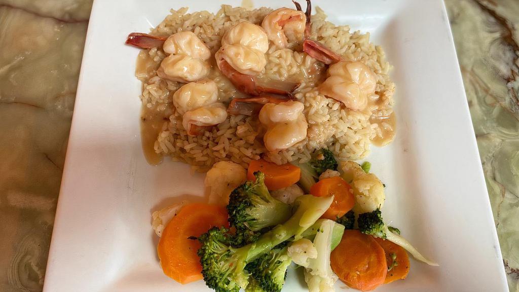 Shrimp Scampi
 · Shrimp sautéed in a garlic scampi sauce, served over rice.