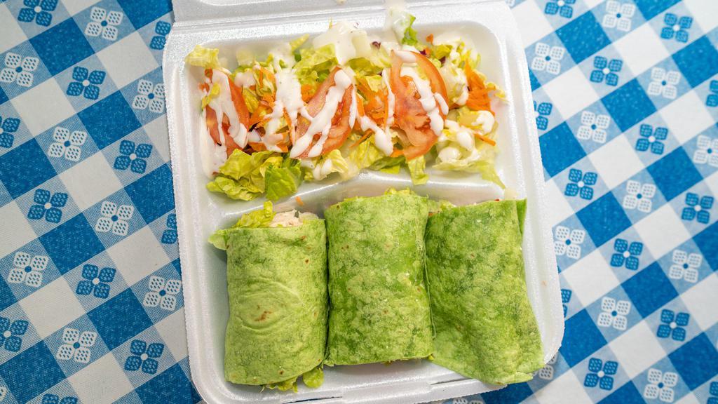 Chicken Wrap Plate · Roasted chicken seasoned with spices. Wrapped in spinach tortilla with garlic mayo spread, lettuce, tomato and Feta cheese. Served with salad.
