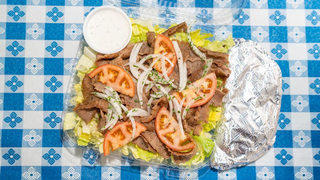Gyros Salad  · Popular. Marinated slices of beef and lamb, topped with lettuce, tomato, and onion. Served with tzatziki sauce and 1 pita bread.