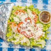 Greek Salad · Romaine lettuce, tomato, onion, Kalamata olives, feta cheese, bell pepper, and cucumber. Ser...