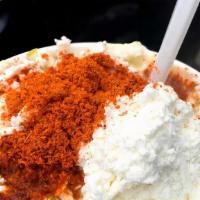 Esquite · Mexican style corn with Tajín chile ,cotija cheese and mayo.