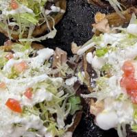 3 Pcs Sopes · Homemade thick tortilla topped with beans, cream, cheese and lettuce. / Aderezados con frijo...
