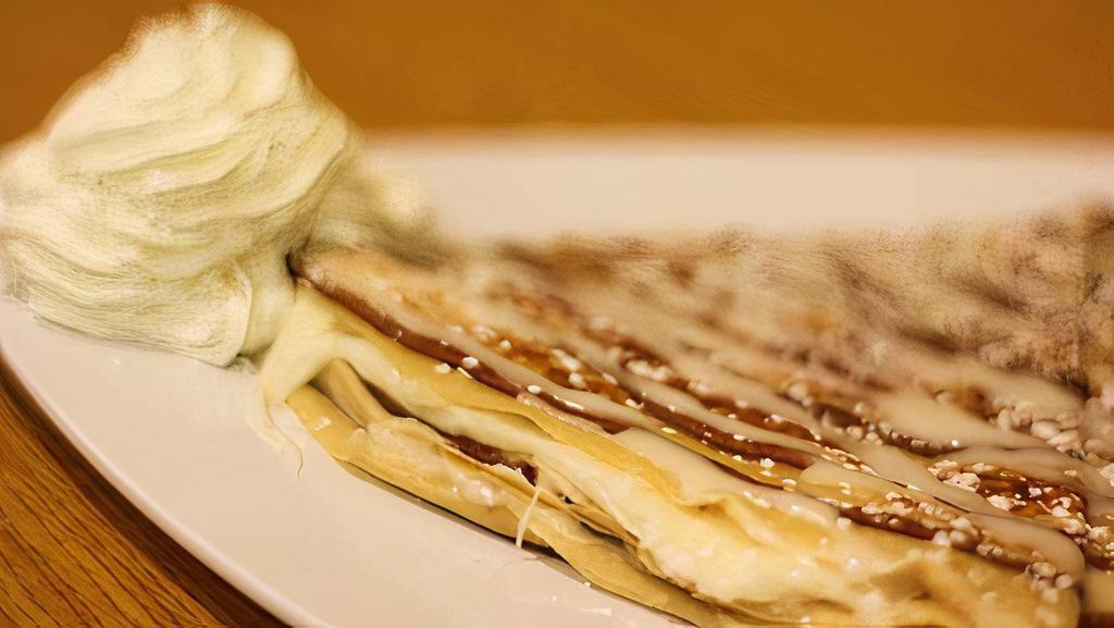 Cinnamon Roll Crepe · Melted sweet cream, cinnamon sugar in cinnamon swirled crepe, and topped with icing.