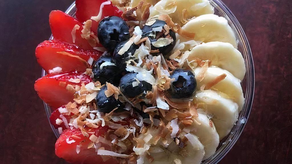 Acai Bowl · Acai base topped with granola, honey, sliced bananas, strawberries, blueberries, and toasted coconut.