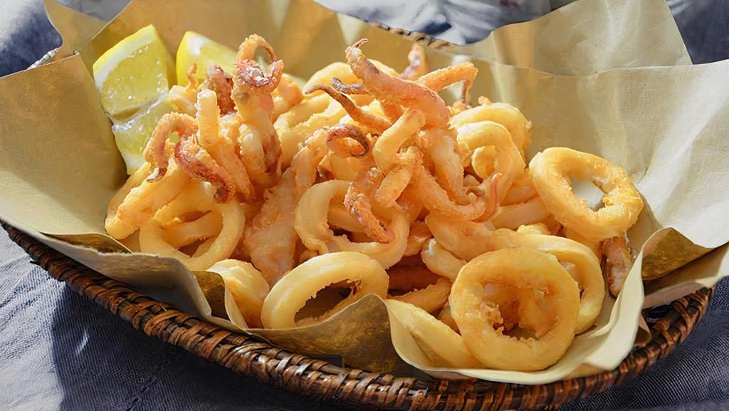 Fried Calamari · Crispy fried calamari, shrimps, and parsley lemon aioli sauce.