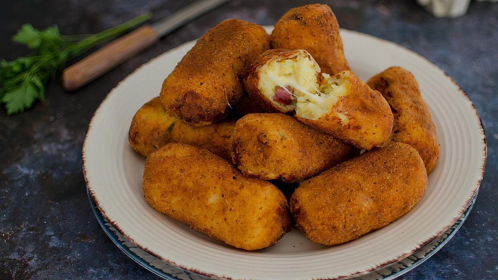 Potato Croquettes · 3 pieces. With smoked mozzarella and salame.