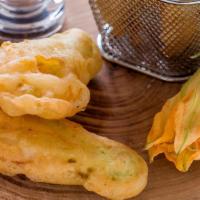 Zucchini Blossom · Lightly fried zucchini flower filled with imported smoked mozzarella.