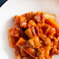 Rigatoni Pasta All'Amatriciana · traditional Italian sauce based on guanciale (cured pork cheek), pecorino romano cheese, San...