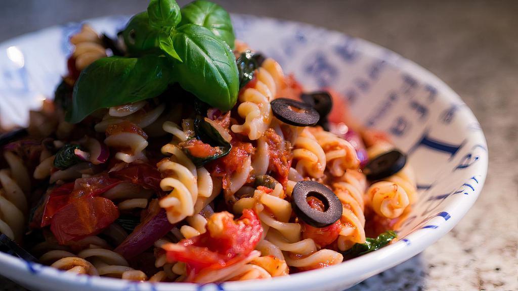 Fusilli Pasta Lla Puttanesca  · vegetarian sauce made with tomatoes extravirgin olive oil Sicilian Capers, parsley , gaeta black olives.
