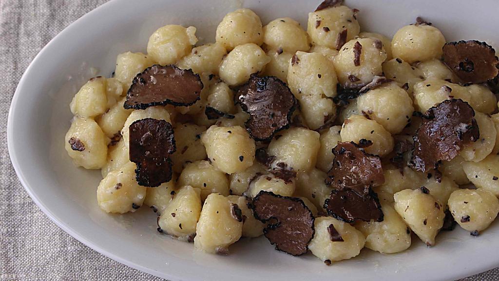 Black Truffle Gnocchi · Porcini mushrooms and potatoes gnocchi, black truffle sauce, shaved black truffle.