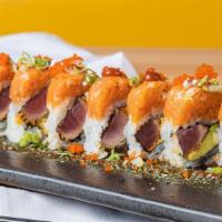 Crazy Tuna Roll · Pepper tuna and avocado topped with spicy tuna, spice sriracha masago and tempura rake. Raw.