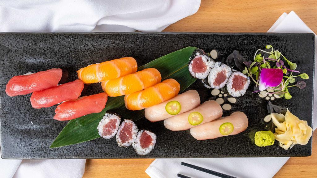 Tri-Color Sushi · Three pieces of tuna, three pieces of salmon, three pieces of yellowtail and one tuna roll. Raw.
